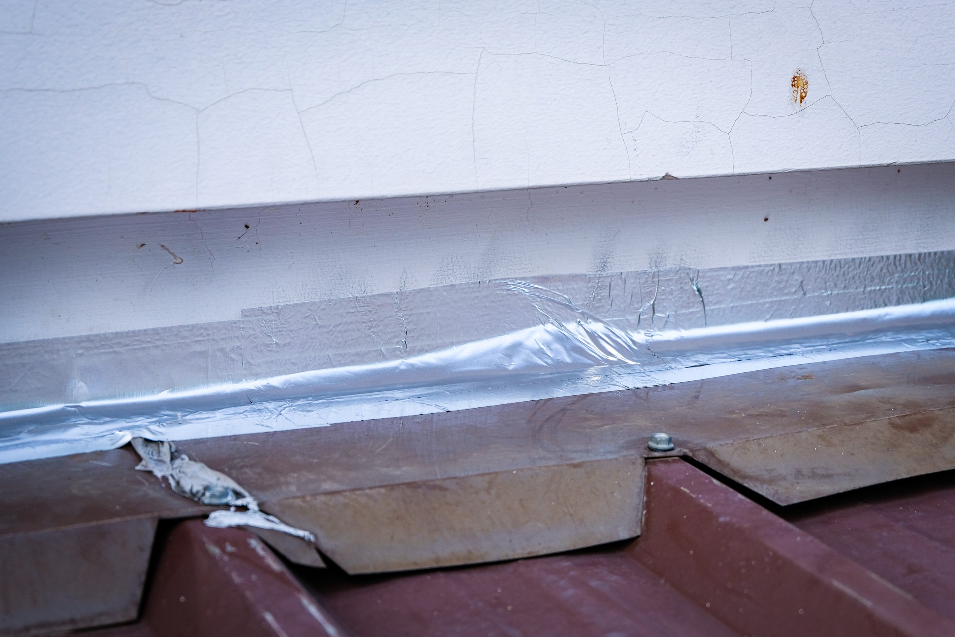 Roof repairing by using aluminum foil tape to prevent water leak before rainy season